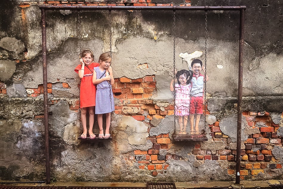 Discover amazing street art in Malaysia George Town Penang Malaysia Street Art Swing Kids Fun