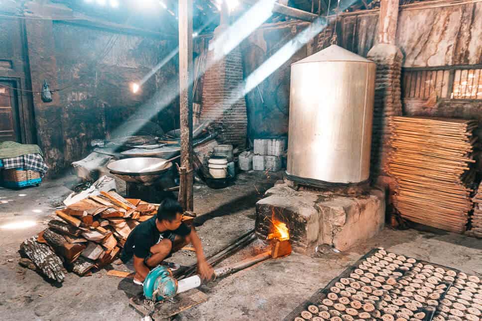 Travel Diary #22: 2 weeks in Java with our kids Guy working in a local krupuk factory near Yogyakarta