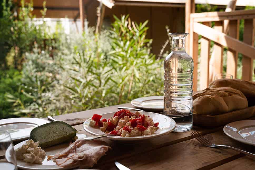 Luxury glamping Italy: Procida Camp Resort review Relaxing glamping holiday lunch in the garden at our safari tent Procida