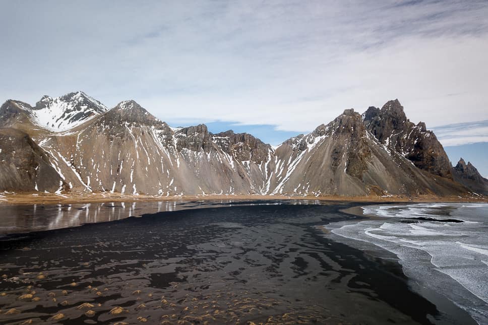 20+ Best things to do in Iceland: Our Ultimate Iceland Bucket List View of the mountains from Vestrahorn in Stokness, Iceland