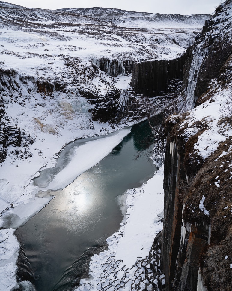 studlagil canyon with basalt columns in winter in east iceland