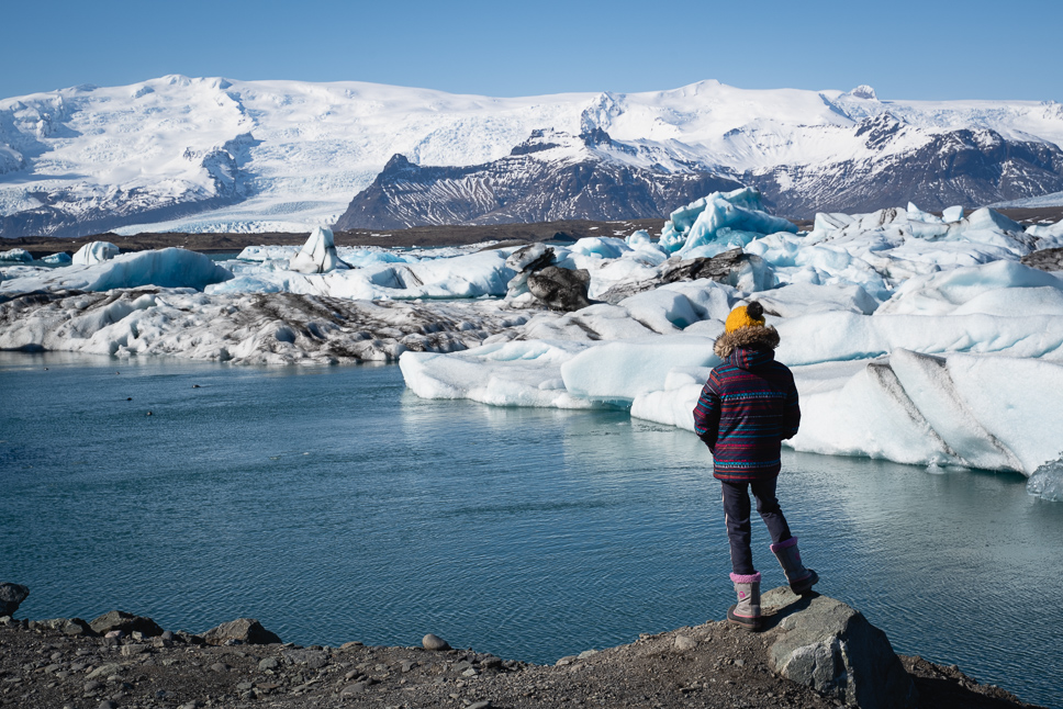 Yuna is watching the glacier at Jokulsarlon in Iceland