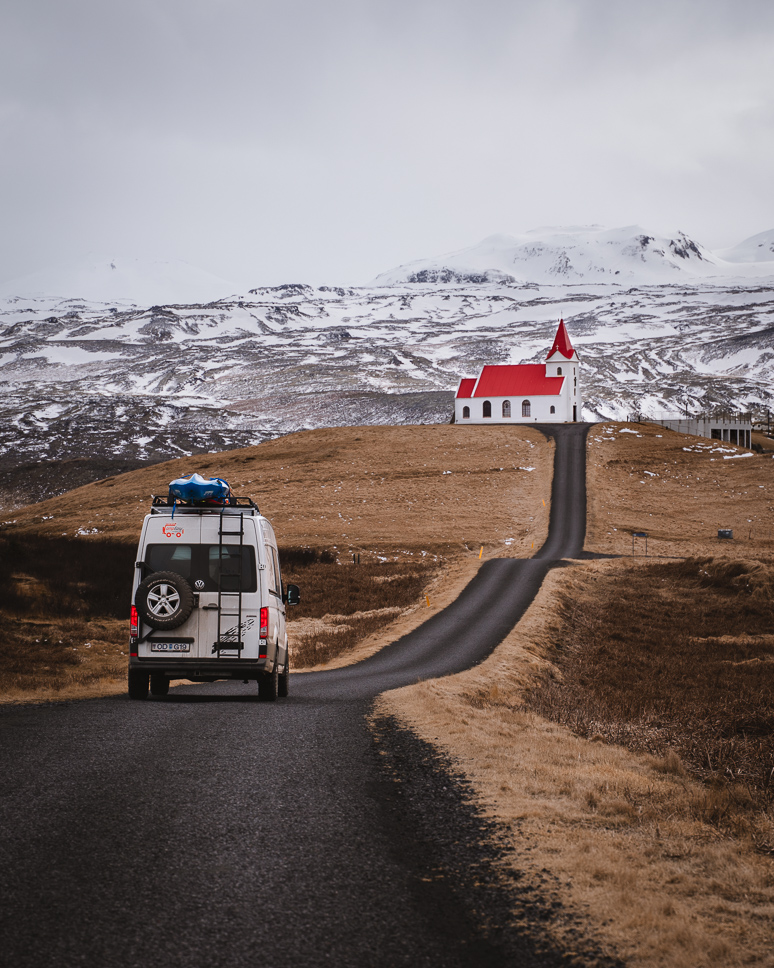 15 best and most impressive things to do in Iceland camper campeasy with view on church with red roof in west iceland