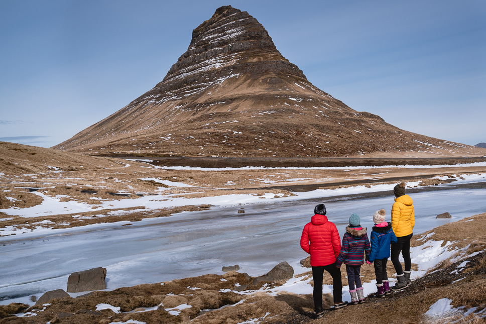 20+ Best things to do in Iceland: Our Ultimate Iceland Bucket List Family looking at Kirkjufell mountain in Iceland