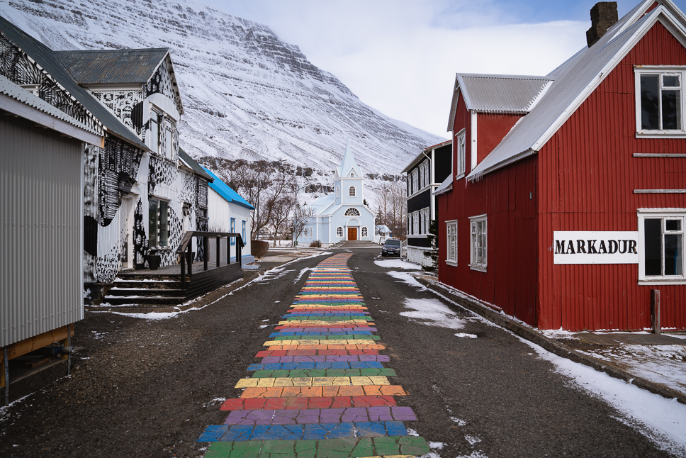 a rainbow path to the chruch of seydisfjordur in iceland