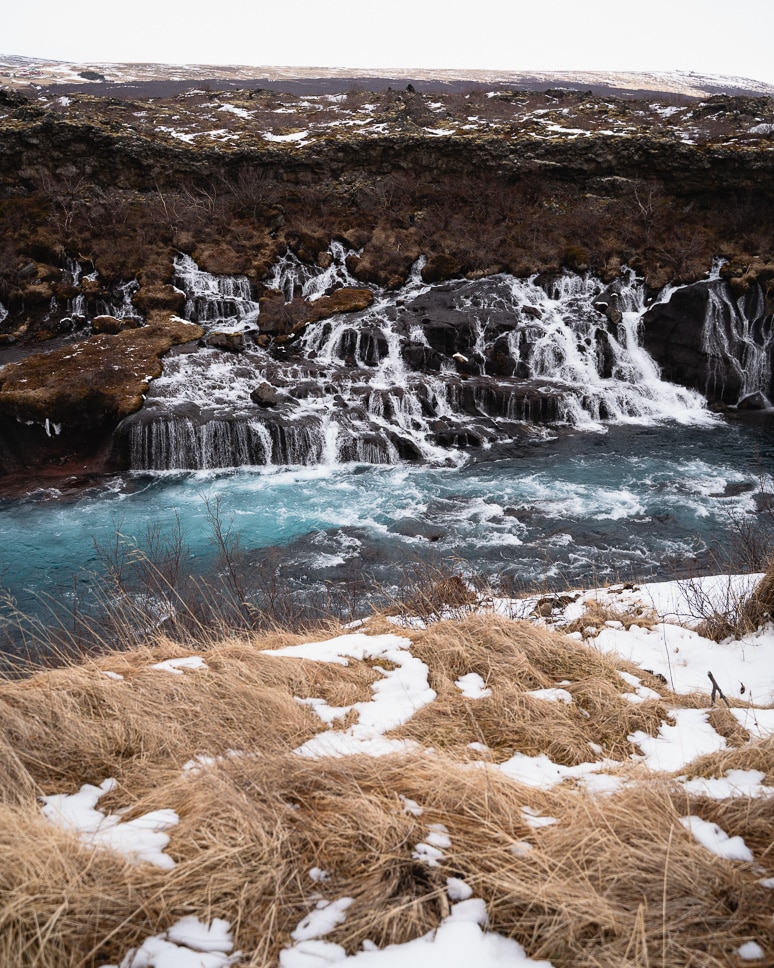 20+ Best things to do in Iceland: Our Ultimate Iceland Bucket List Hraunfossar waterfall lava field in winter in Iceland