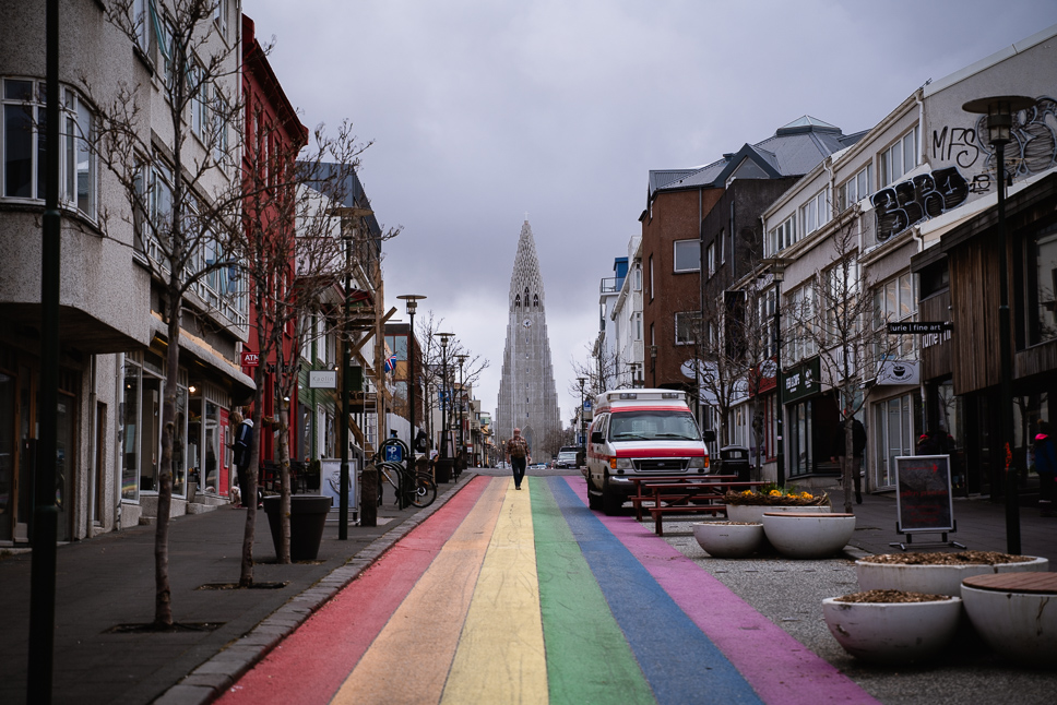20+ Best things to do in Iceland: Our Ultimate Iceland Bucket List Rainbow Street Laugavegur in Reykjavik, Iceland with the Hallgrímskirkja Church in the background