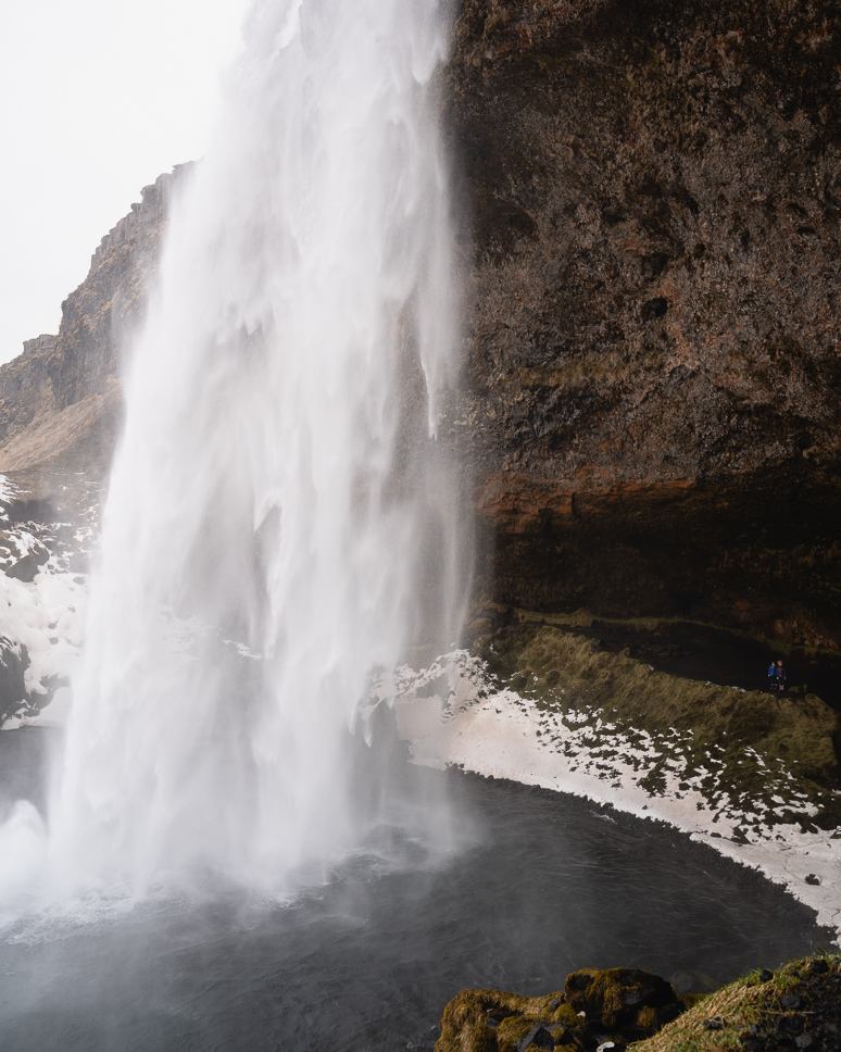 20+ Best things to do in Iceland: Our Ultimate Iceland Bucket List Two children stand behind Seljalandsfoss and admire this mighty waterfall in South Iceland
