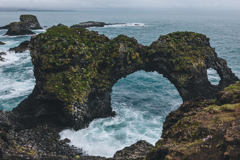 Snaefellsnes Peninsula in Iceland: the best things to do + itinerary Black basalt rocks and a rock arch over the ocean at Arnarstapi in Snaefellsnes Iceland
