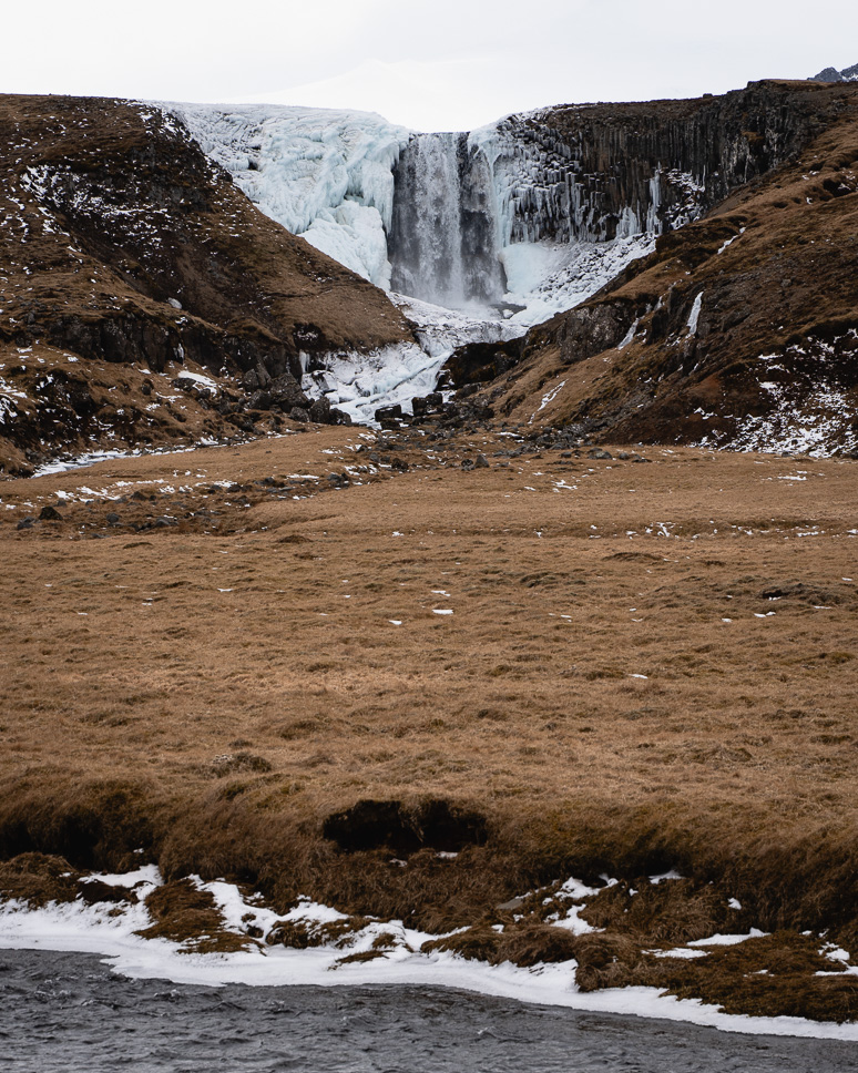Snaefellsnes Peninsula in Iceland: the best things to do + itinerary Svodufoss waterfall in winter in Snaefellsnes Iceland