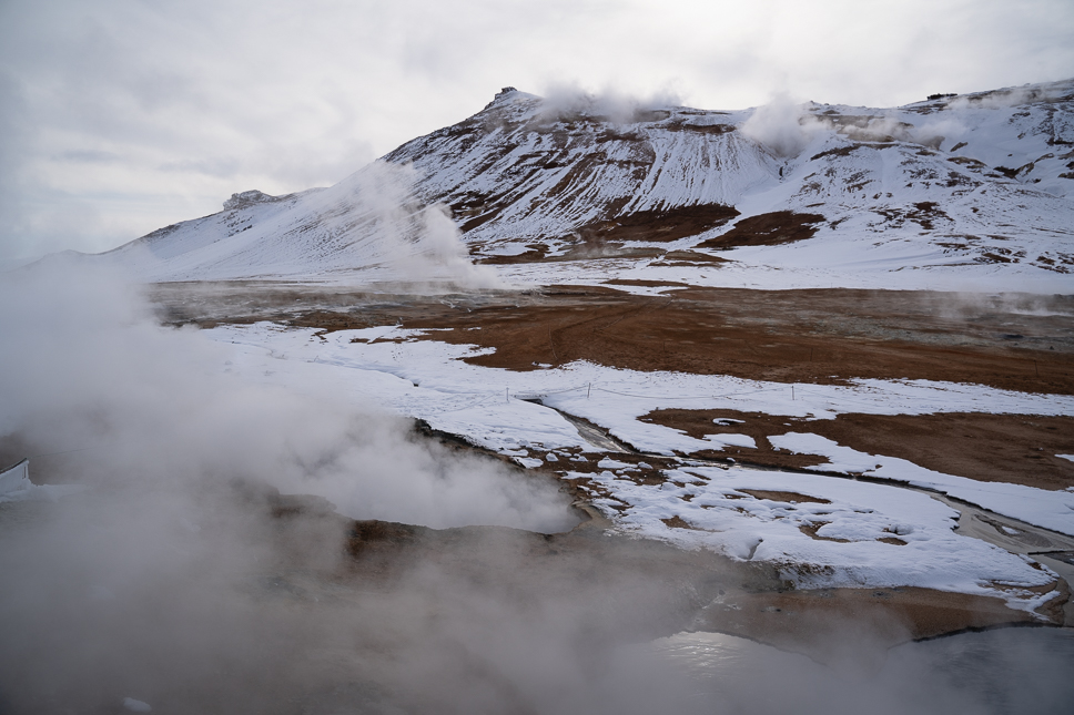 20+ Best things to do in Iceland: Our Ultimate Iceland Bucket List Thermal activity and steaming mud pools among snow-capped mountains in Hverir near Myvatn in North Iceland