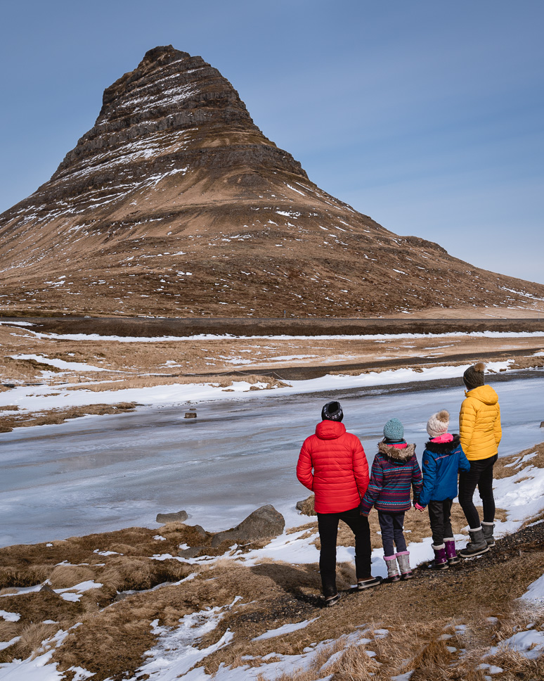 Snaefellsnes Peninsula in Iceland: the best things to do + itinerary Family looking out over Kirkjufell mountain in winter in Iceland