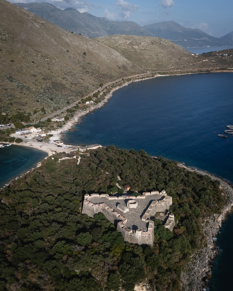 Albania road trip: our ultimate itinerary for 10 days to 3 weeks a drone picture from the Porto Palermo Castle in ALbania