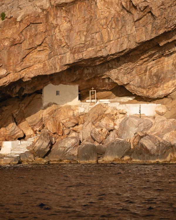 What to do on Syros: Our favourite island in the Cyclades View from the water of the stunning rock chapel of Agios Stefanos.